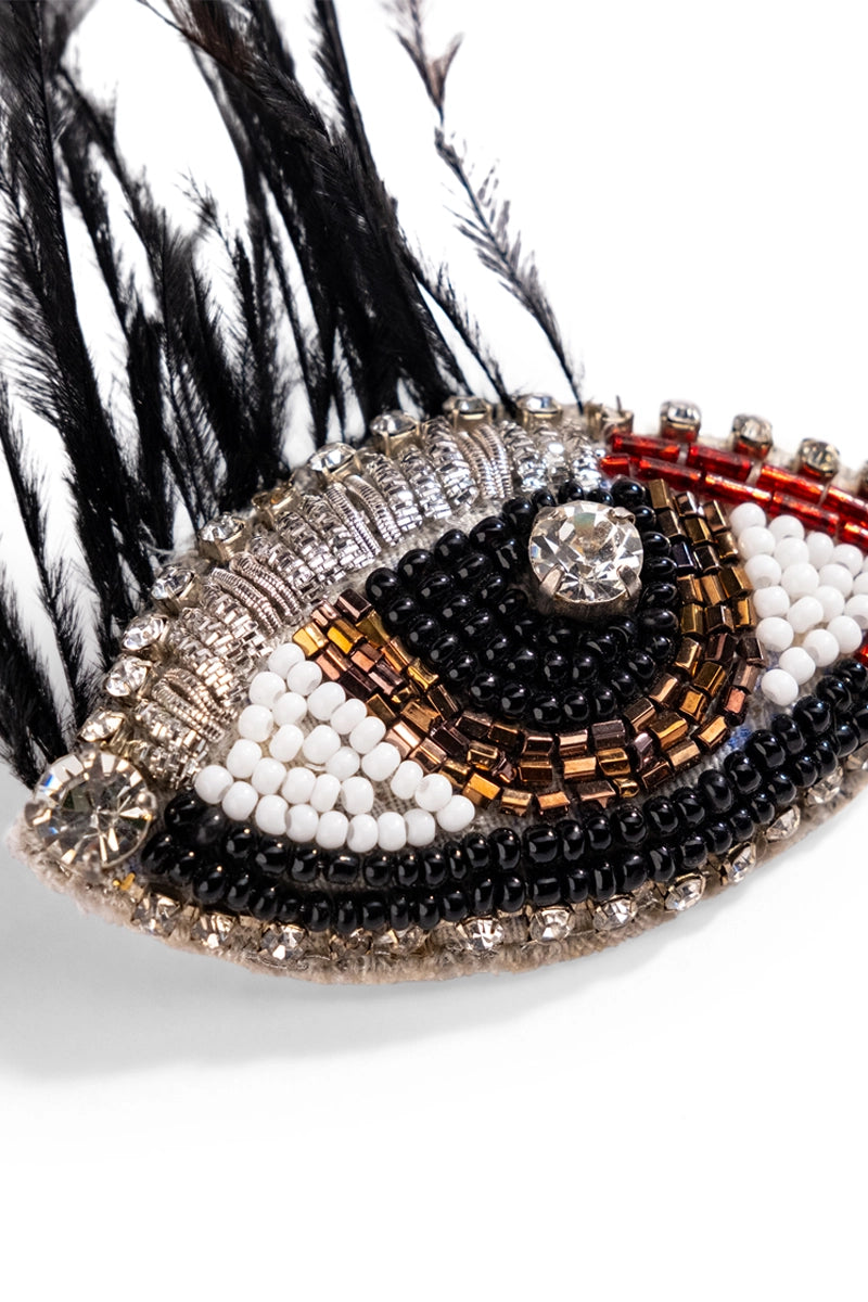 Wintry eye charm brooch